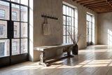 Maierato 66-Inch Reclaimed Pine Pedestal Dining Bench, Seats 3 in a city loft