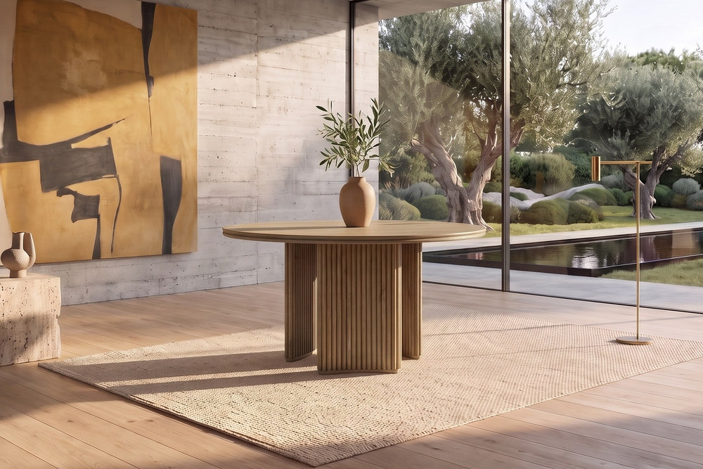 Malvito 53-Inch Round Ash Veneer Reeded Pedestal Dining Table in a sunlit villa dining room