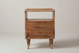 The Mamoiada nightstand in golden-brown mango, front view on a light studio backdrop