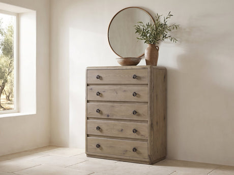 Maniago 42-Inch Weathered Natural Oak 5-Drawer Chest under a round bronze mirror in a villa bedroom