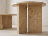 Close-up of the Mantova Gold Beige Marble Nesting Coffee Tables, Set of 2: the two gold beige marble slabs set in a T under the side table's top
