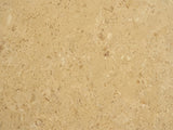 Close-up of the Mantova Gold Beige Marble Nesting Coffee Tables, Set of 2: the veining of the polished gold beige marble