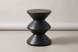 The Marineo black concrete zigzag side table, three-quarter view on a light studio backdrop
