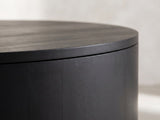 Close-up of the Marostica Black Mango Drum Coffee Table: the overhanging top over the vertical mango planks of the drum