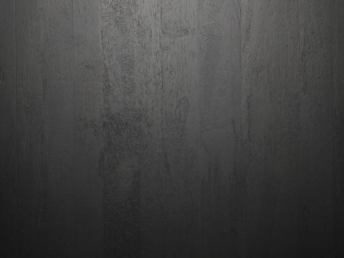 Close-up of the Marostica Black Mango Drum Coffee Table: the black-stained mango grain of the top