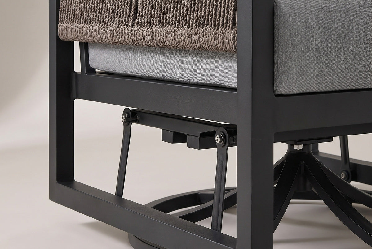 The lower half of the Marsala chair: the black aluminum side frame just above the floor, two glider links with bolted pivots and the round swivel base