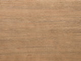Close-up of the Matelica Reclaimed Pine Trestle Coffee Table: the antique brown grain of the reclaimed pine top
