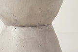 Close-up of the light grey lightweight concrete on the Mazzaro side table, with fine pores and the seam at the waist