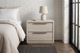 Melfi gray oak nightstand against a white-painted brick wall in a Chicago bedroom with a black steel window, a herringbone floor and a charcoal rug