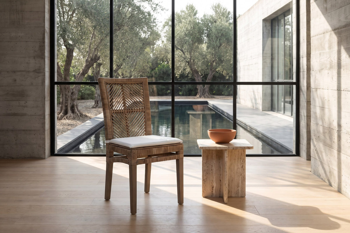 Mendicino Tall-Back Rattan and Mahogany Dining Chair in a sunlit villa dining room