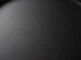 Close-up of the Mesoraca Black Mango Pedestal Side Table: the matte black finish of the recessed tray top