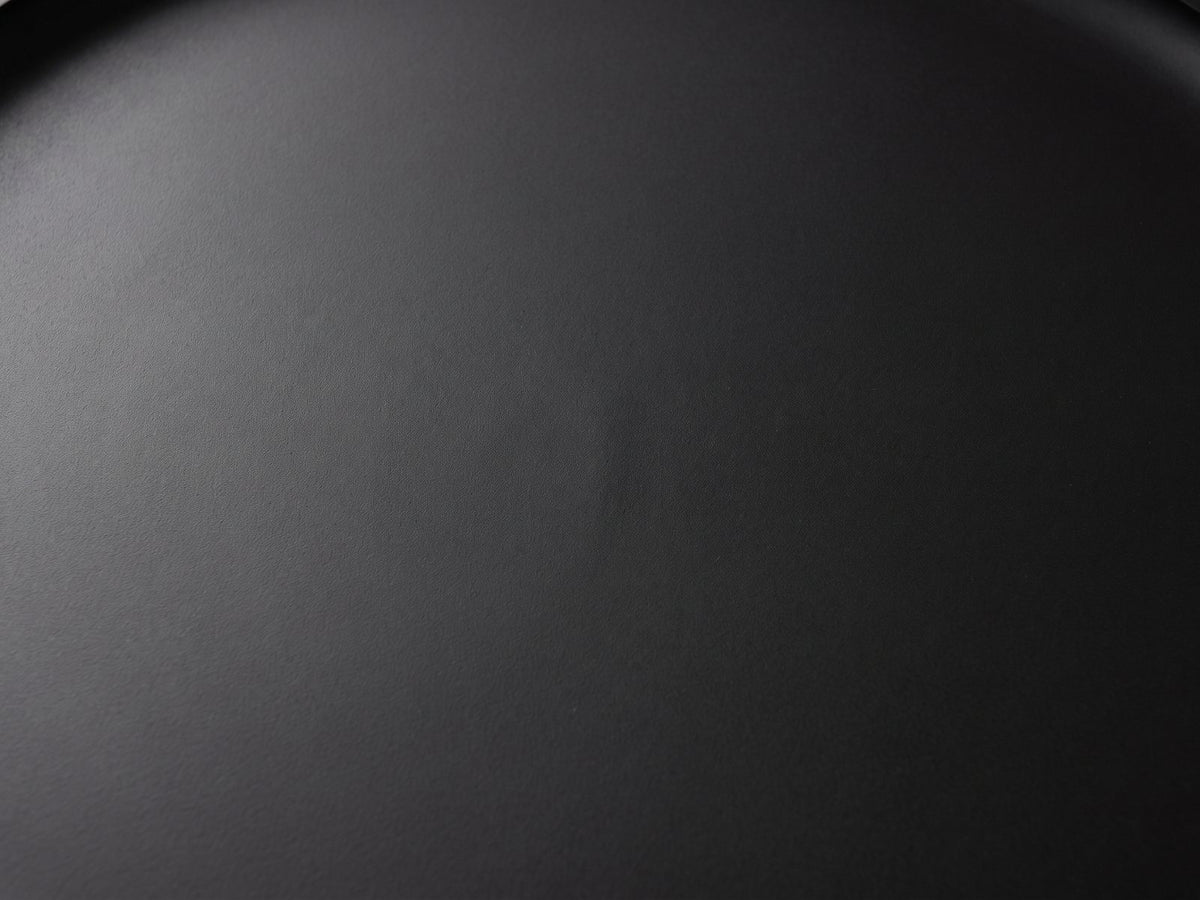 Close-up of the Mesoraca Black Mango Pedestal Side Table: the matte black finish of the recessed tray top