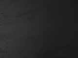 Close-up of the Miglionico Black Mango Wood Faceted Drum Side Table: the black-stained mango grain of the top
