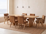 Minturno 95-Inch Light Oak Sled Base Dining Set with 6 Chairs in a bright coastal dining room on a jute rug