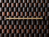 Close-up of the Mirano 33-Inch Velvet Mocha Carved Mango 3-Drawer Chest: the hand-carved rounded blocks of a drawer front and its slim brass bar pull