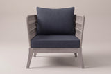 The Mistretta lounge chair seen straight from the front: flared rope arms, slate grey seat and back cushions, greywash acacia base
