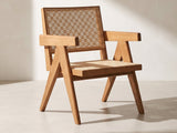 Modena Cane Lounge Chair in natural against a plaster wall in morning light