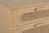The top of the Mogoro nightstand: the rounded top edge, the upper drawer with its pill-shaped cane panel and wood bar pull, and the moulding band above the lower drawer