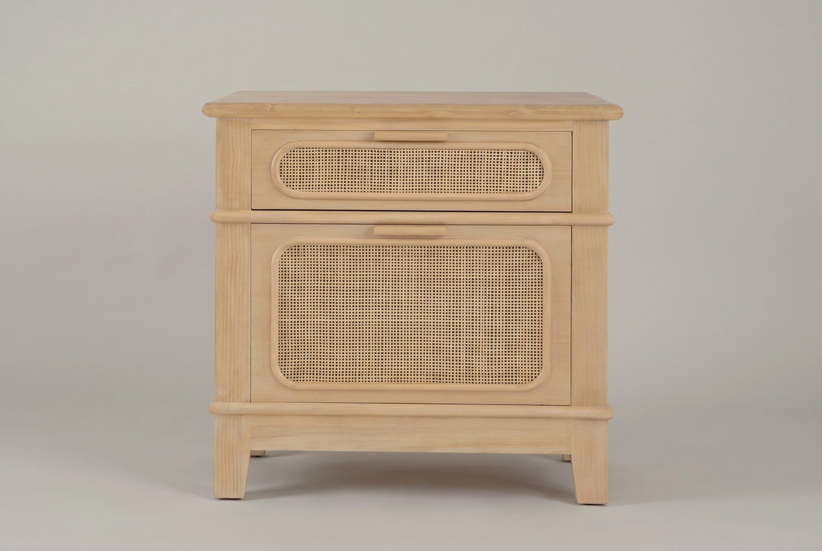 The Mogoro nightstand in natural pine, front view on a light studio backdrop