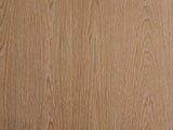 Close-up of the Mondovi 36-Inch Round Carved Limed Ash Drum Coffee Table: the limed ash grain of the round top