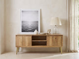 Monopoli Mango and Brass Media Console styled with a leaning print, a lamp and ceramics in a bright plaster room