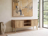 Monopoli Mango and Brass Media Console seen from the side, under a large abstract painting in a bright living room