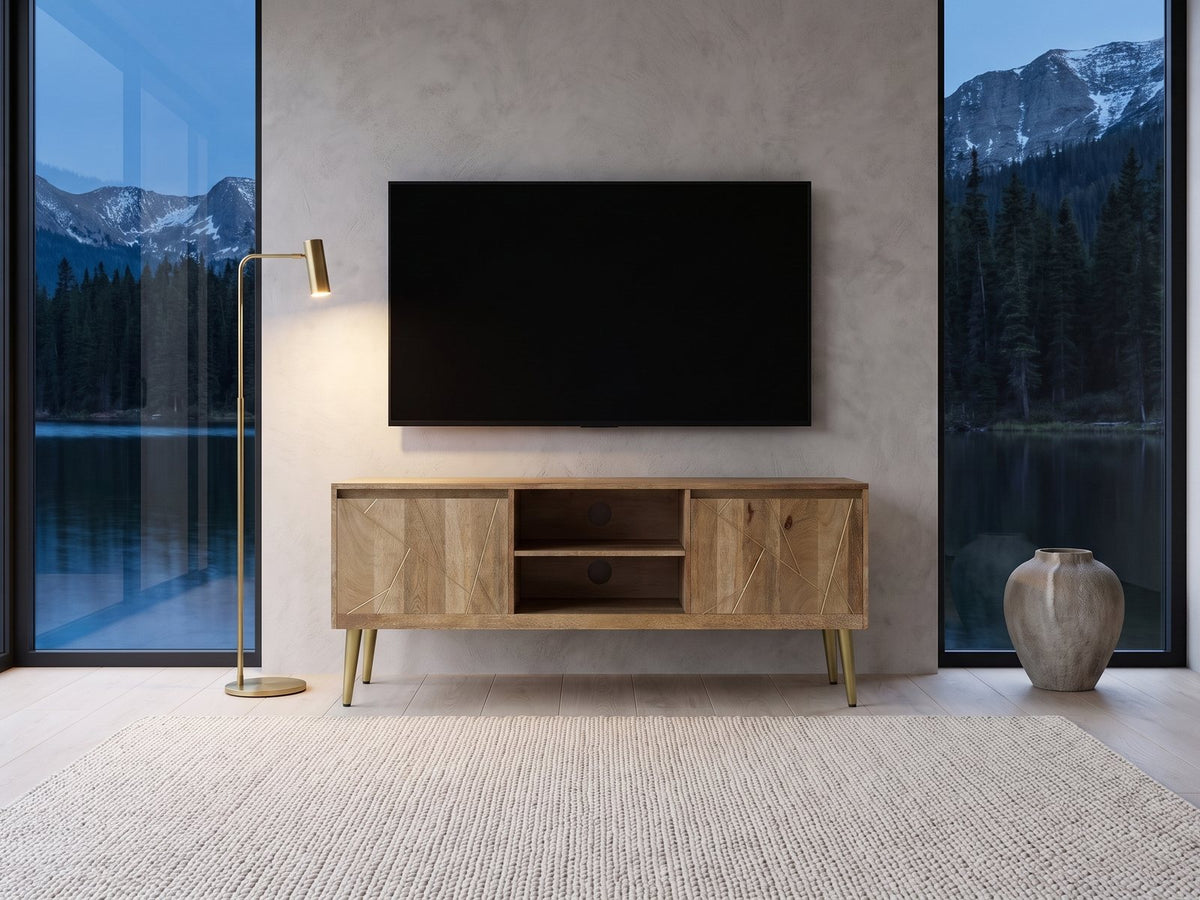 Monopoli Mango and Brass Media Console under a wall-mounted screen in a mountain lake house at dusk