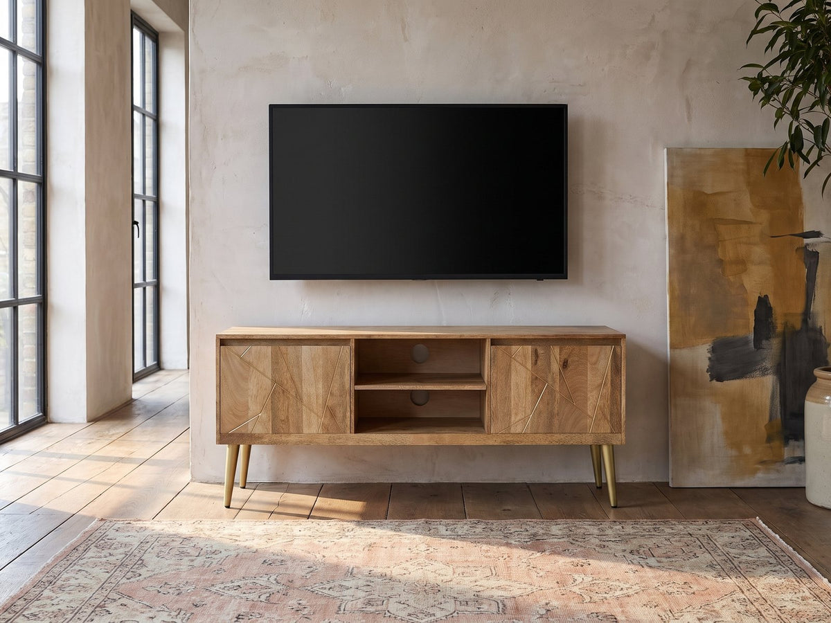 Monopoli Mango and Brass Media Console under a wall-mounted screen in an industrial loft