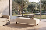 Montalto 60-Inch Ivory Sherpa Upholstered Bench Ottoman in a living room