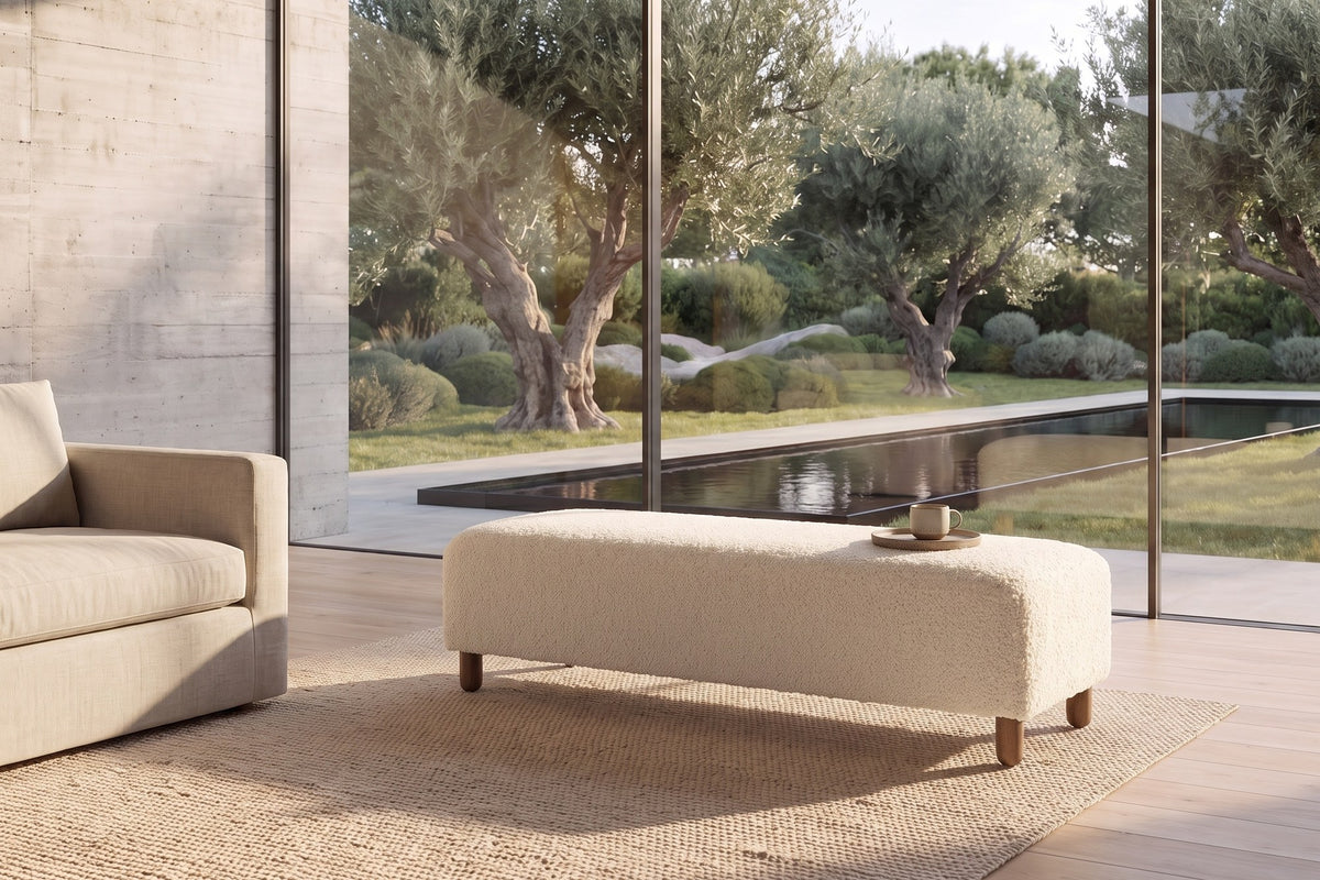 Montalto 60-Inch Ivory Sherpa Upholstered Bench Ottoman in a living room