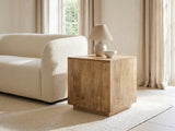 Montecatini Square Mango Side Table with a lamp and a ceramic bowl beside a cream boucle sofa in a bright plaster room
