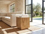 Montecatini Square Mango Side Table beside a linen sofa in a poolside villa