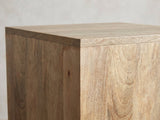 Close-up of the Montecatini Square Mango Side Table: the square top edge over the vertical mango planks