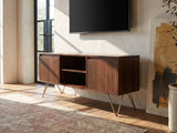 Montefalco Solid Mango Media Console seen from the side, under a wall-mounted screen in an industrial loft