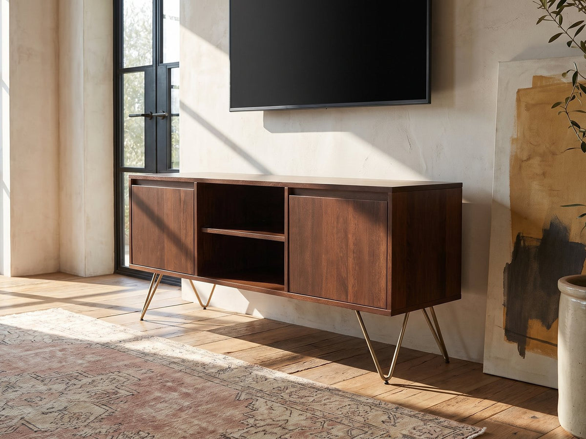 Montefalco Solid Mango Media Console seen from the side, under a wall-mounted screen in an industrial loft