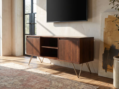 Montefalco Solid Mango Media Console seen from the side, under a wall-mounted screen in an industrial loft