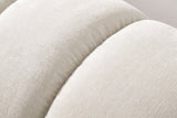 Close-up of the beige chenille on the Montenerodomo bed: a deep seam between two plump padded channels