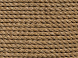 Close-up of the Montescaglioso Woven Seagrass Drum Side Table: the twisted seagrass rope wrapped around the side