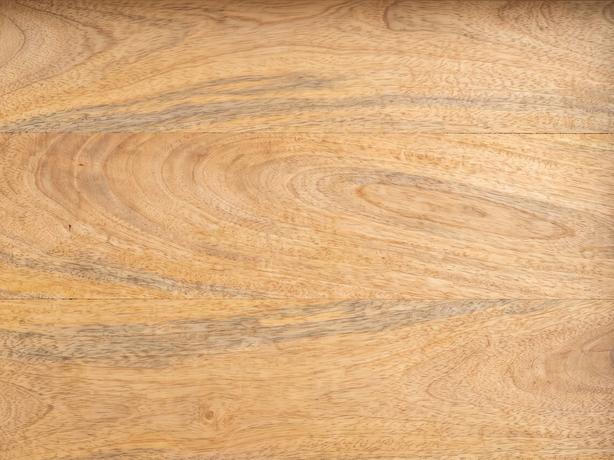 Close-up of the Montisi Natural Mango Pedestal Side Table: the natural mango grain of the tray top