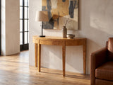 Mottola Mappa Burl Half-Moon Console Table against a plaster wall in an industrial loft