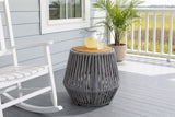 Naro rope side table with a pitcher of lemonade beside a white rocking chair on a Beaufort, South Carolina porch, a blue-grey shiplap wall and the marsh beyond (chair and decor not included)