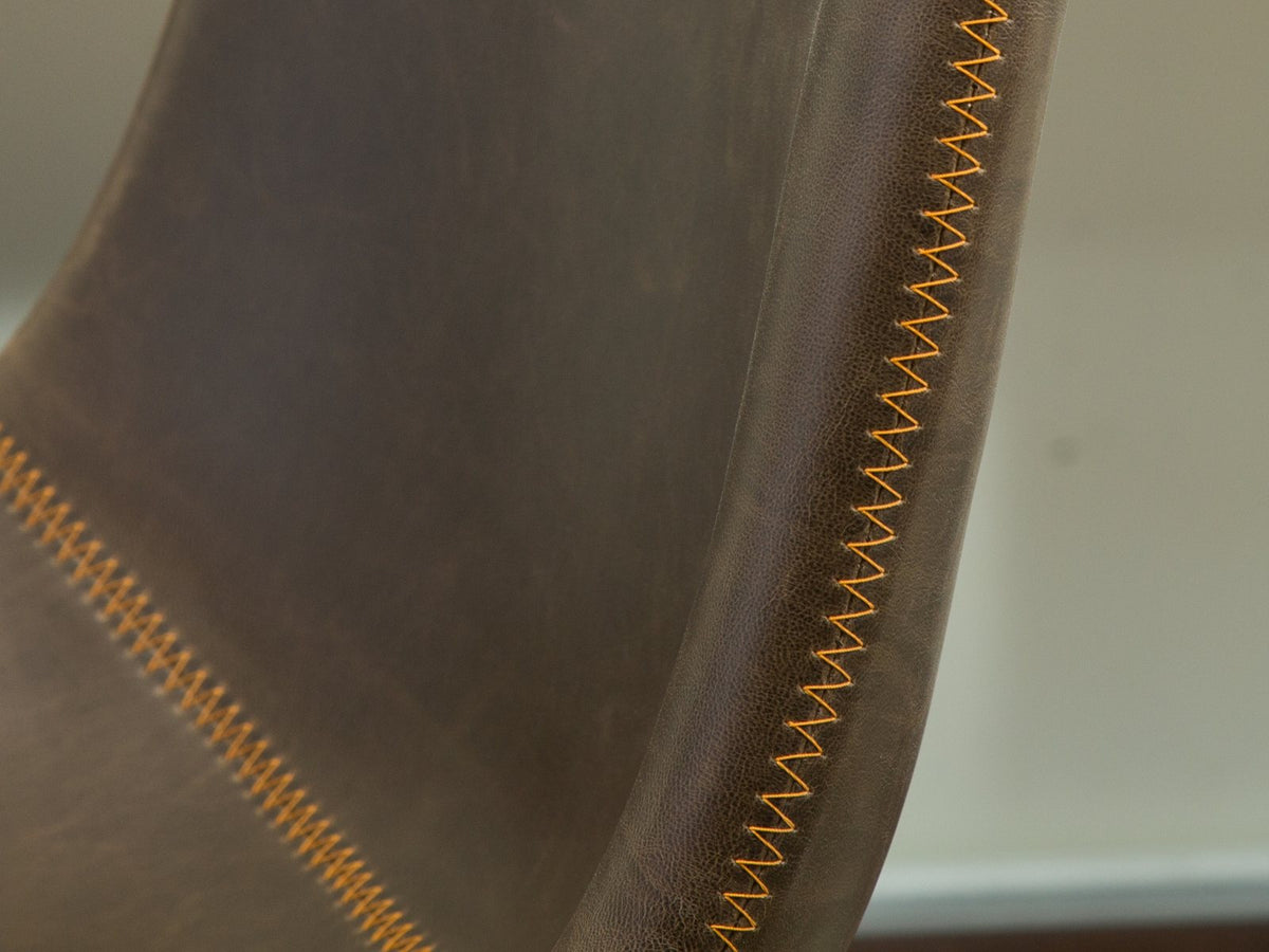 Close-up of the Nicastro 64-Inch Antique Black Farmhouse Dining Set with 4 Chairs: stitching