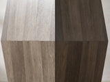 Close-up of the Nicotera Ash Grey Mango Faceted Side Table: the flat faces meeting at the crease at mid-height
