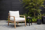 Niscemi acacia rope club chair on bluestone pavers in a Houston garden, a charcoal cedar fence, ferns and a Japanese maple behind (side table not included)