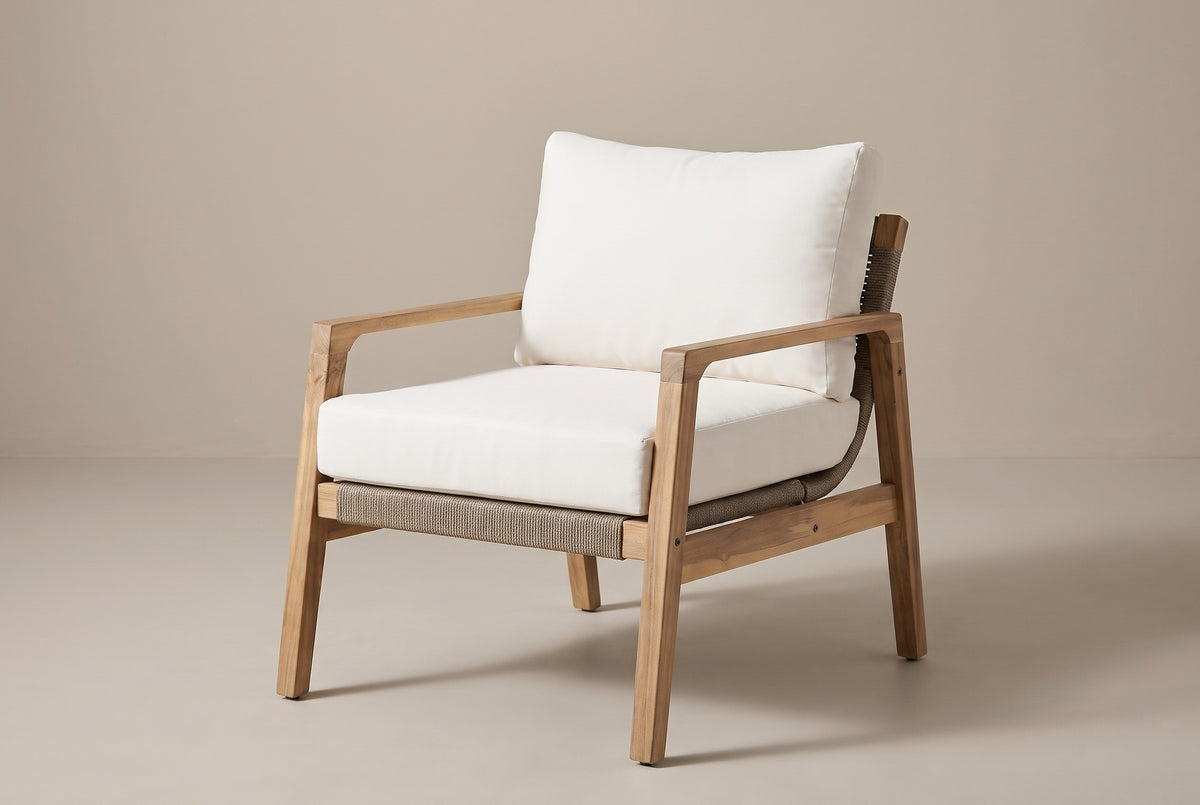 The Niscemi acacia rope club chair with white cushions, three-quarter front view on a light studio backdrop