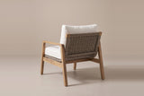 The Niscemi chair from behind: the woven rope back stretched between angled acacia posts, raked back legs and side stretchers