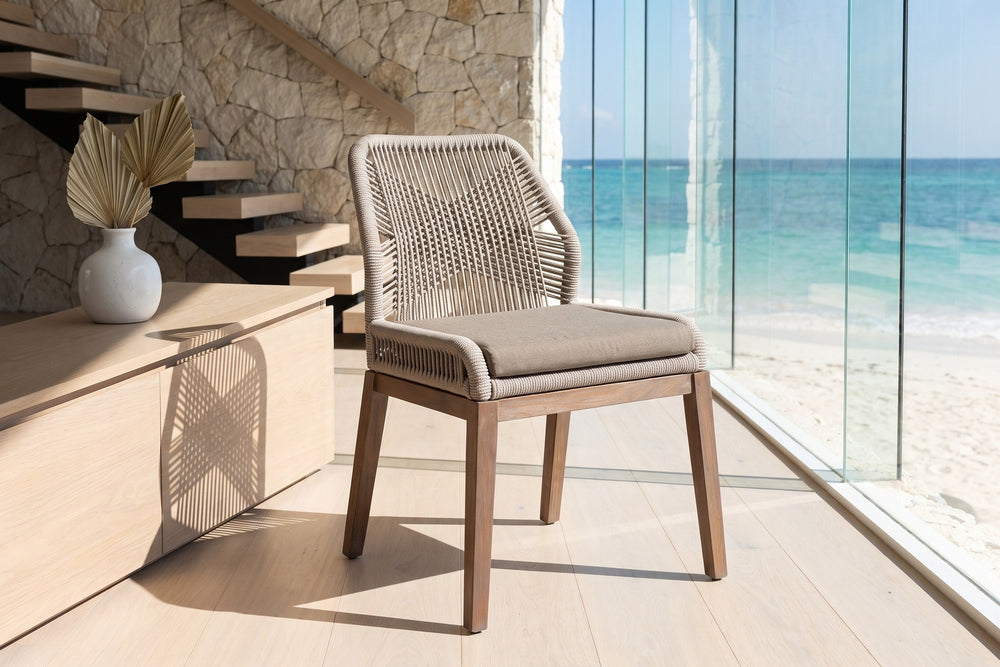 Nocera Woven Rope and Mahogany Dining Chair in an oceanfront glass house