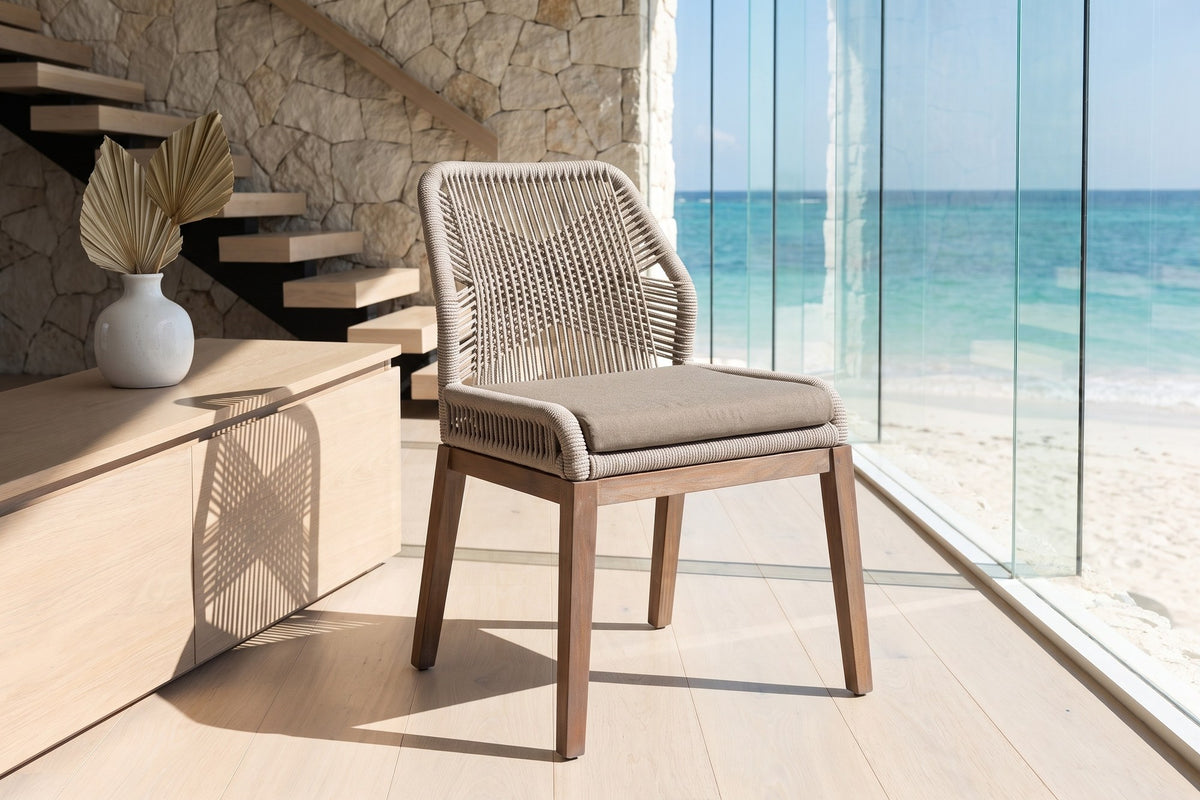 Nocera Woven Rope and Mahogany Dining Chair in an oceanfront glass house