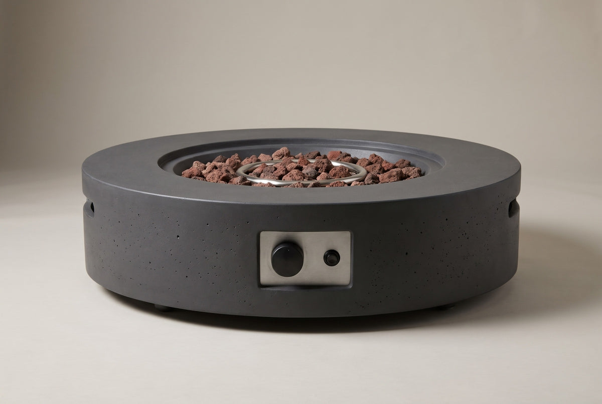 The Noto fire pit seen straight from the front: the round drum, the control niche in the middle of the side wall and the low base