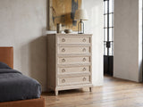 Oderzo 36-Inch Washed Oak 5-Drawer Chest against a plaster wall in an industrial loft bedroom